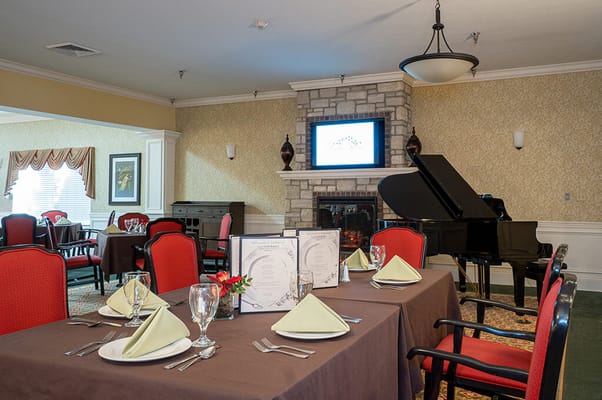 Dining area with elegant table setting and piano