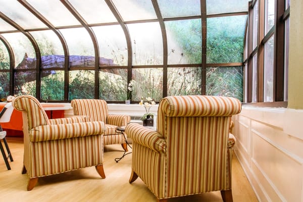 Interior view of a cozy common area with chairs