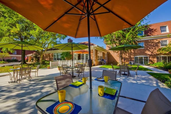 Outdoor dining area with tables and umbrellas