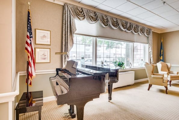 Interior common area with a piano and seating