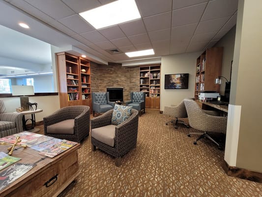 Cozy common area with bookshelves and seating