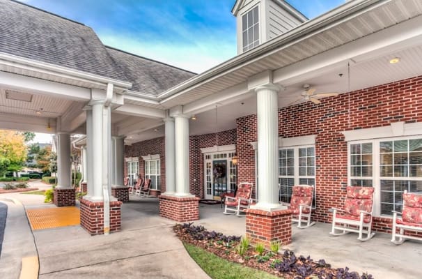 Exterior view of the nursing home with rocking chairs