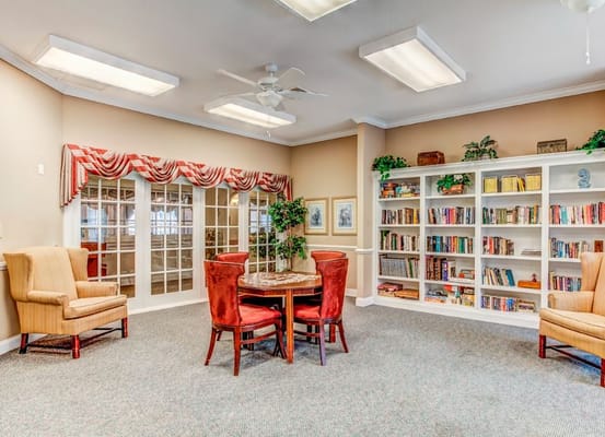 Interior common area with seating and bookshelves