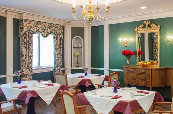Elegant dining room with tables set for meals