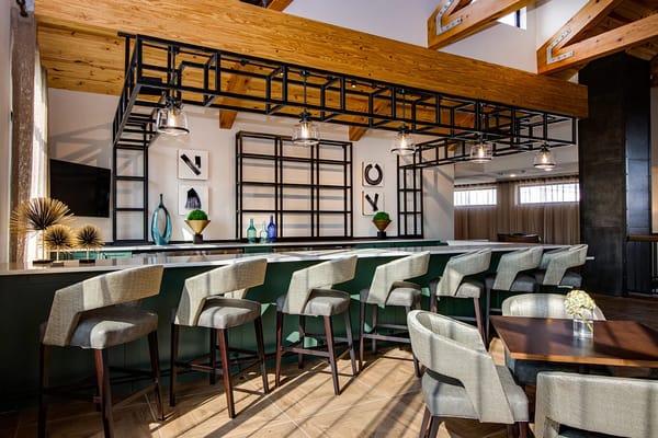 Stylish bar area with modern seating and decor