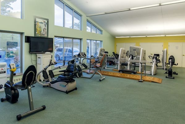 Interior view of fitness equipment in a bright exercise room