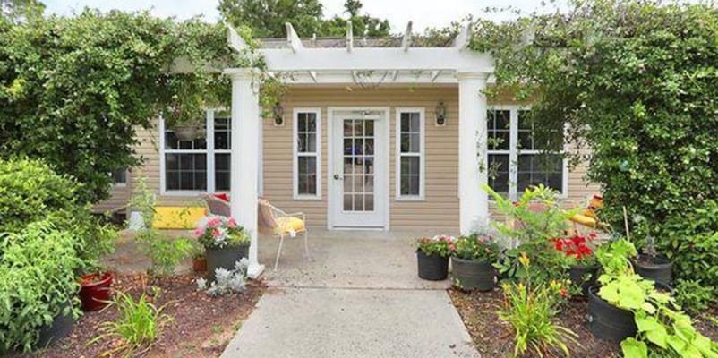 Front entrance of Savannah Place with flowers