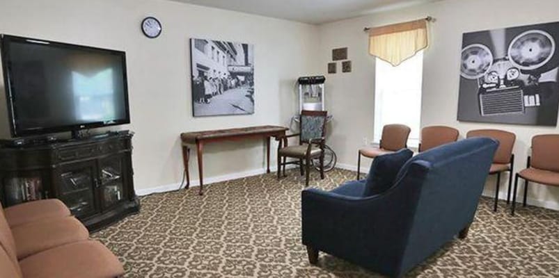 Common area with seating and television