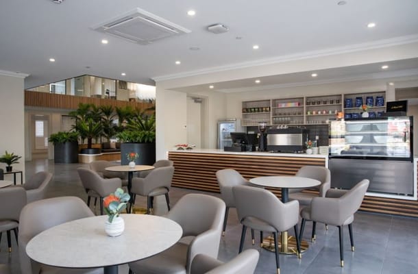 Interior view of the cafe area with seating and a service counter