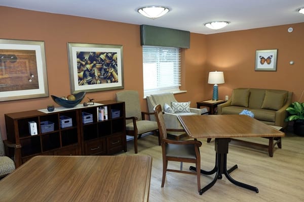 Bright and inviting common area with comfortable seating and art decor