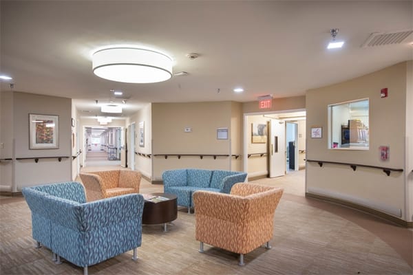 Cozy lounge area with colorful chairs and soft lighting