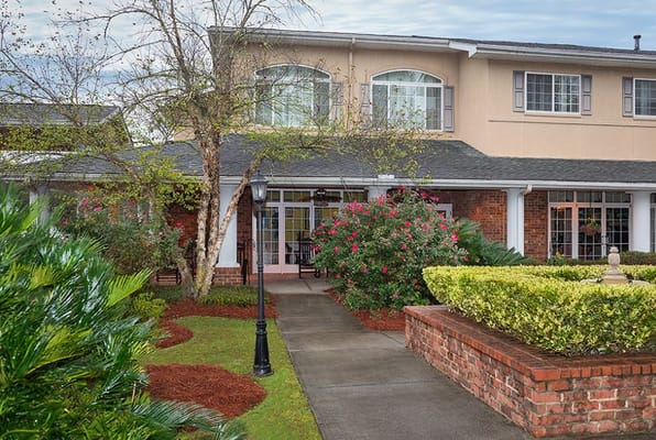 Exterior view of facility entrance with landscaping.