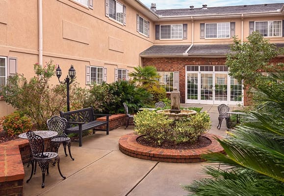 Beautifully landscaped outdoor courtyard with seating