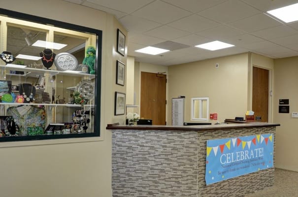 Front desk with display window showcasing jewelry and decorations