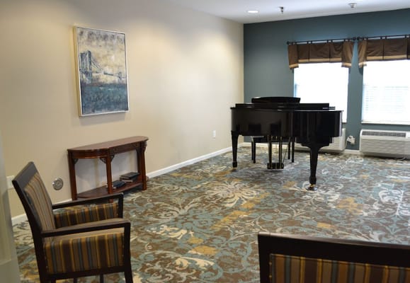 Interior view of a common area with a piano