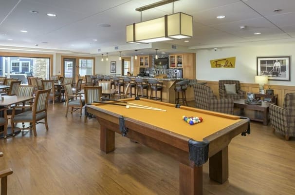 Interior view of a dining area with a pool table