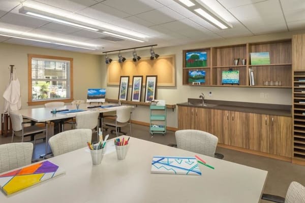 Art room with tables and paintings displayed