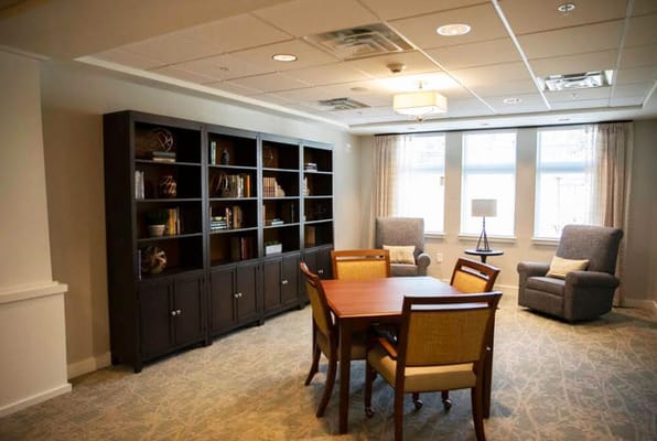 Cozy common area with seating and bookshelves