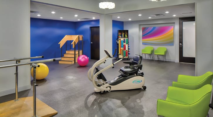 Gym area with exercise equipment and colorful decor