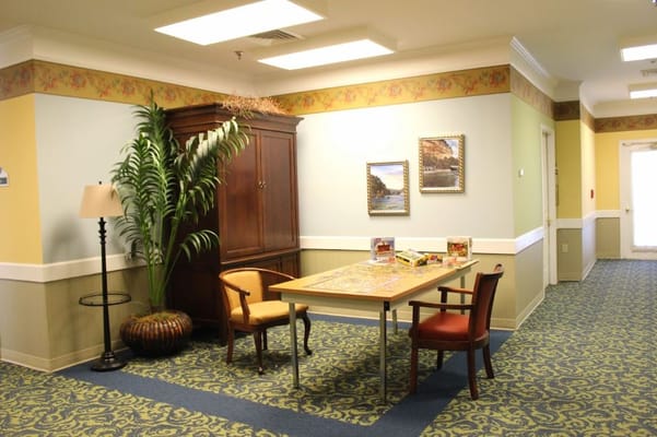 A cozy common area with a table and chairs