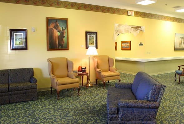 Interior lounge area with seating and artwork