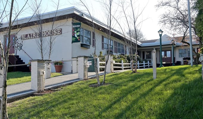 Exterior view of Blaire House with landscaped grounds