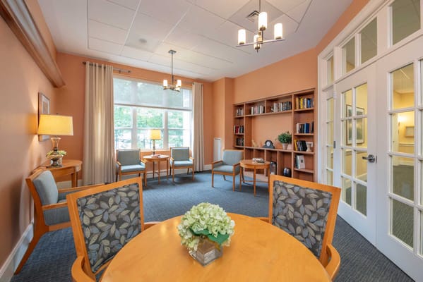Cozy common area with seating and bookshelves