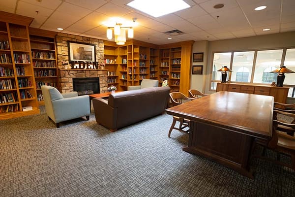 Cozy common area with bookshelves and seating