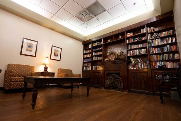 Cozy reading area with bookshelves and seating