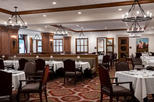 Elegant dining room setup with tables and chairs