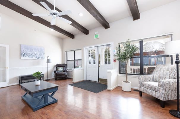 Bright common area with seating and natural light
