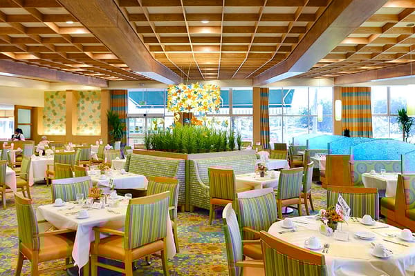 Bright dining room with tables set for meals