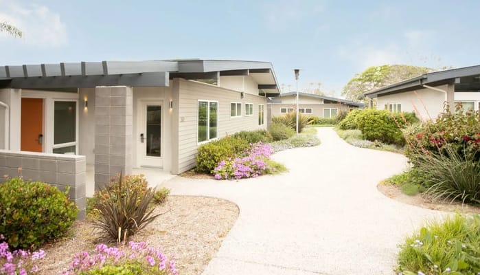 Pathway leading through landscaped gardens at a retirement community