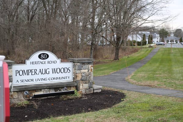Sign for Pomperaug Woods Senior Living Community