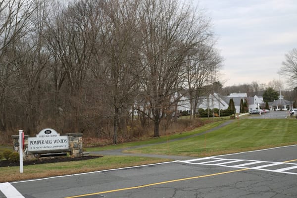 Entrance view of Pomperaug Woods senior living community