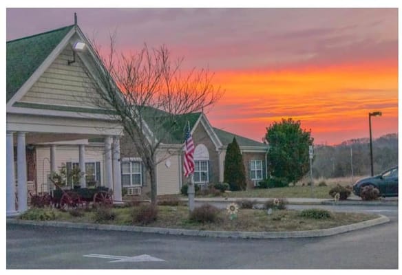 Exterior view of the facility at sunset