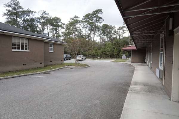 View of an outdoor parking area with trees