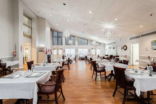 Bright dining area with tables set for meals