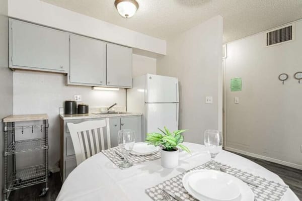 Bright kitchen area with dining table set for two
