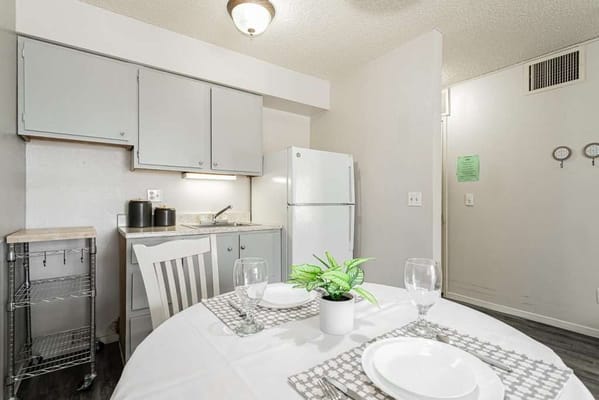 Bright kitchen area with dining table set for two