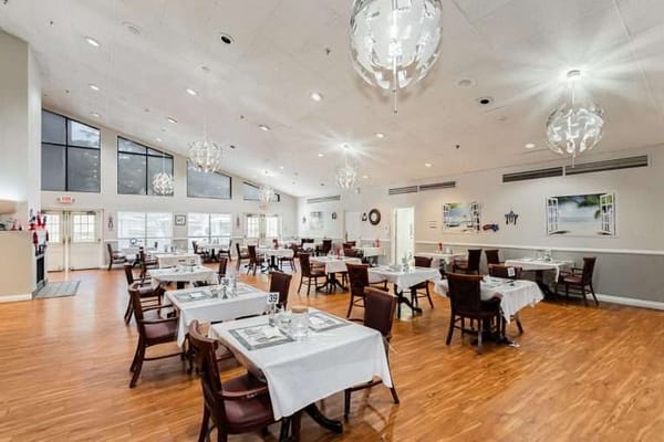 Dining area with elegant tables and light fixtures