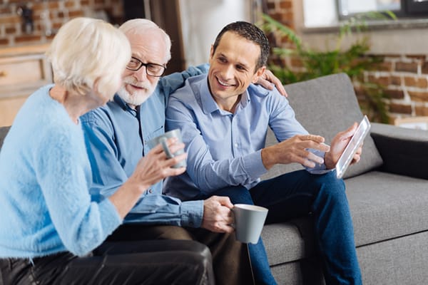 Residents and staff enjoying a conversation in a common area