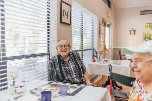 Residents enjoying a meal in the dining room