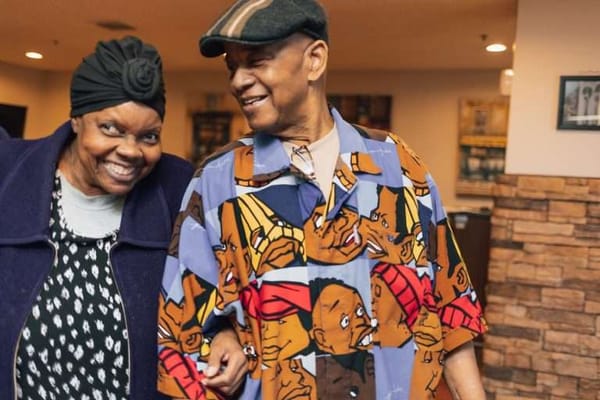 Two residents smiling together in a common area