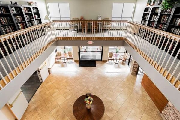 View of a common area with bookshelves and seating