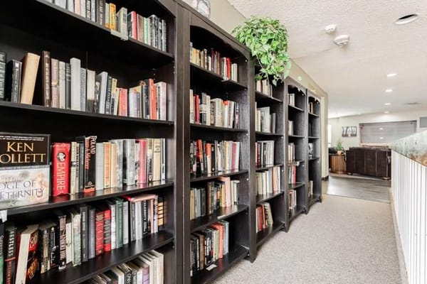 Bookshelves in a cozy common area of the facility