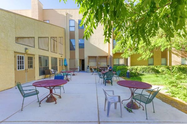 Outdoor seating area with tables and chairs