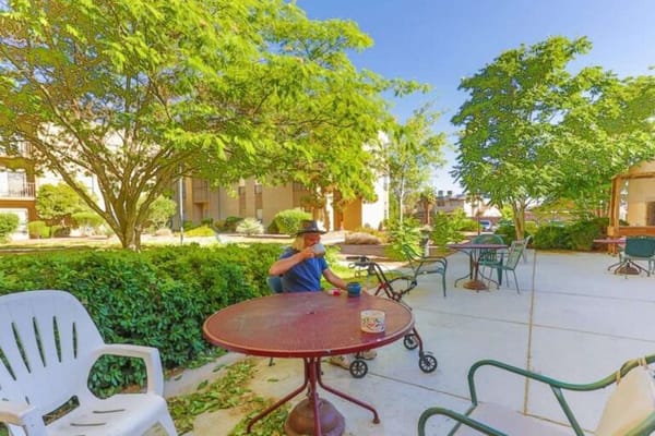 Resident enjoying the outdoor garden area