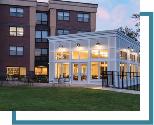 Exterior view of a senior living facility with a sunroom