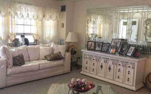 Cozy common area with furniture and personal photos